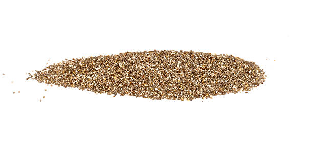 A heap of organic chia seeds rich in omega-3 fatty acids, isolated on white.