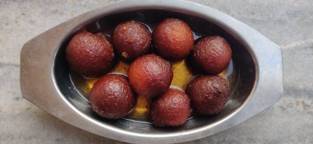 Bowl filled with fresh Gulab Jamun Jaipur, India