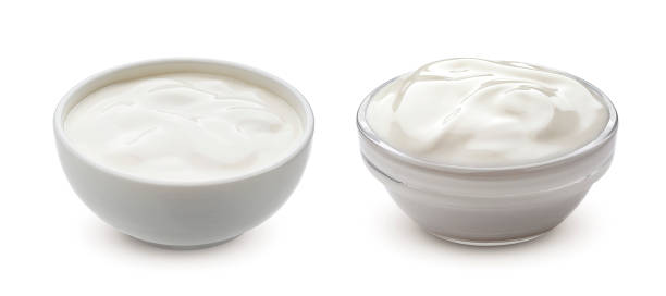 Greek yogurt in bowl isolated on white background with clipping path