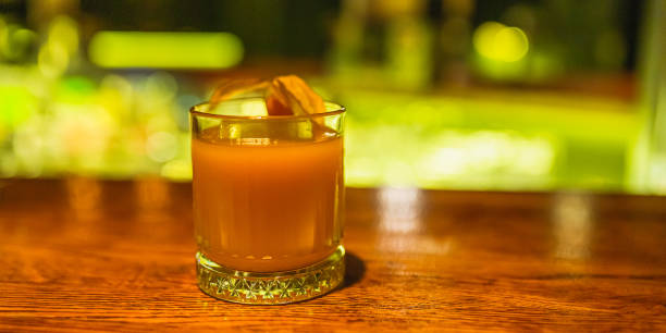 Juice on table. Cocktail on the bar. Fresh alcoholic drink with ice