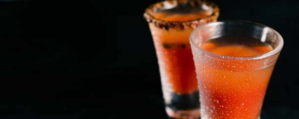 Vodka with tomato juice and spices. Bloody mary cocktail, copy space for text