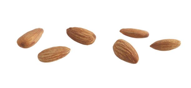 Cut out almonds on white background