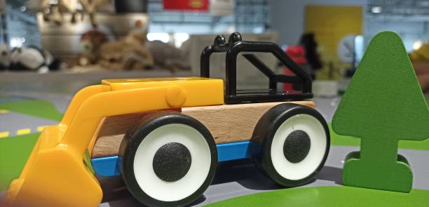 colorful wooden and plastic toy cars for toddlers. bulldozer car toys.