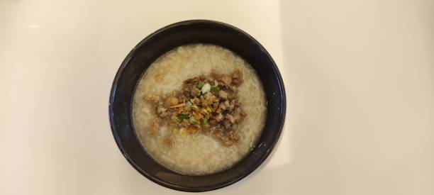 Boiled rice with pork in bowl