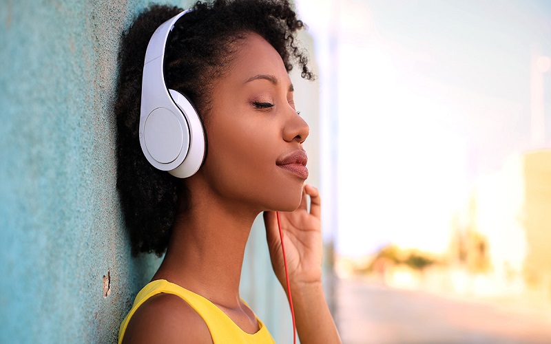 Girl listening music with headphones