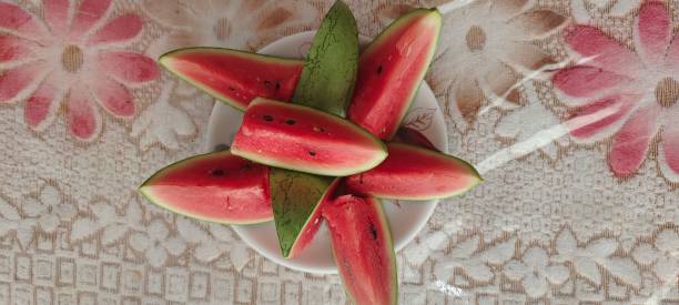 Sliced watermelon on a plate, top view.